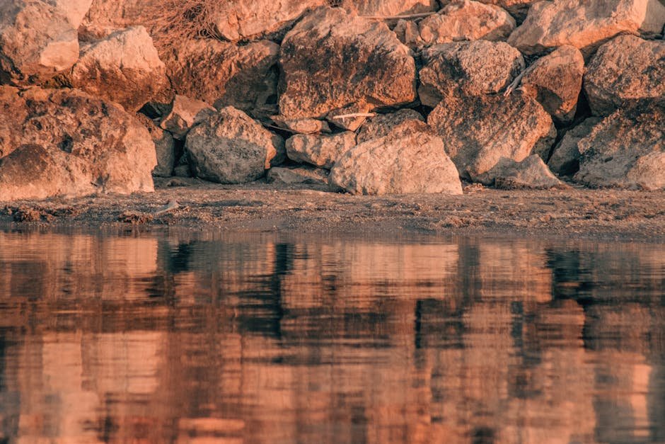 Beach Scenery - Tranquil reflection of rocky shoreline at Urla, #19887119