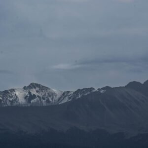 Snow Mountains - A stunning snow-capped mountain range under dark #2422239
