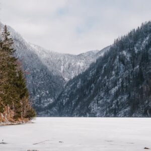 Lake Reflections - A peaceful winter scene featuring snowy mountain #31166672