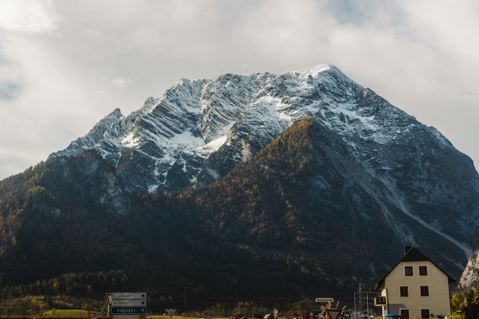 Mountain Landscapes - A breathtaking view of a snowy mountain peak in #34506323