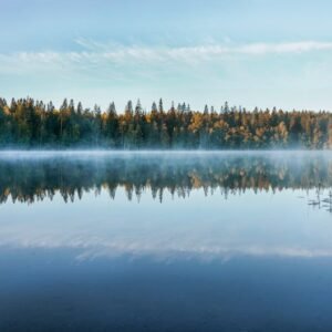 Lake Reflections - A tranquil Finnish lake reflects the forest and  #3693623