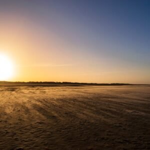 Beach Scenery - Serene sunset view over a deserted beach in Denm #7373041